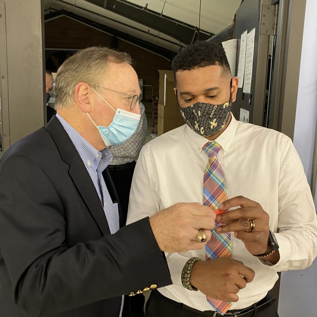 Scott Krewson of Andersen shows Joe Henderson of NCBioTech a Dosimeter made in-house.